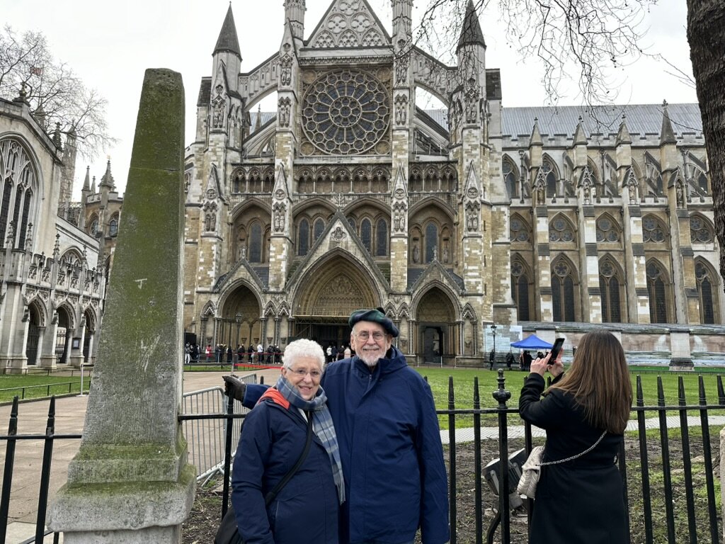 Mom and Dad standing in front of Westminster Abbey in winter