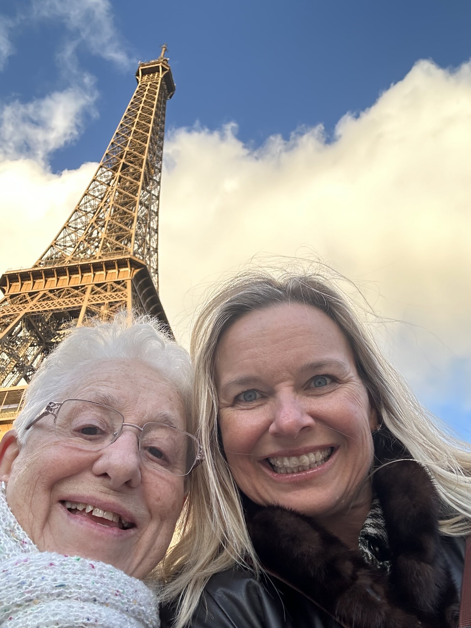 She-Stache and her mother-in-law taking a selfie at the base of the Eiffel Tower
