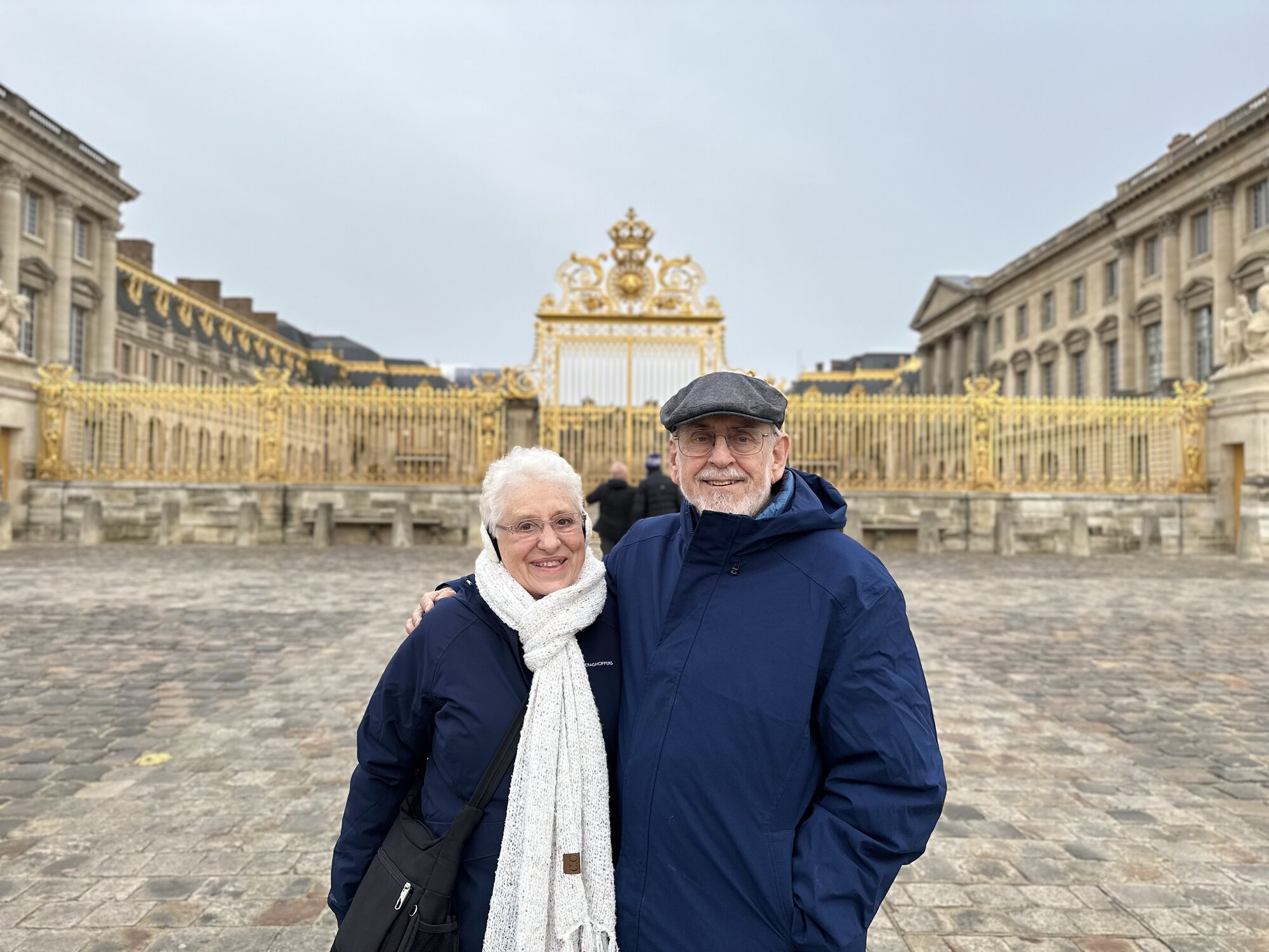 Mom and Dad in front of Versailles' gold gate