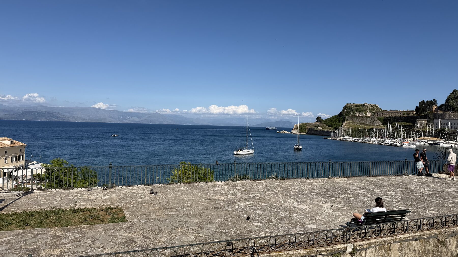 The bay at Corfu from the old town promenade, sailboats moored below the Old Fortress