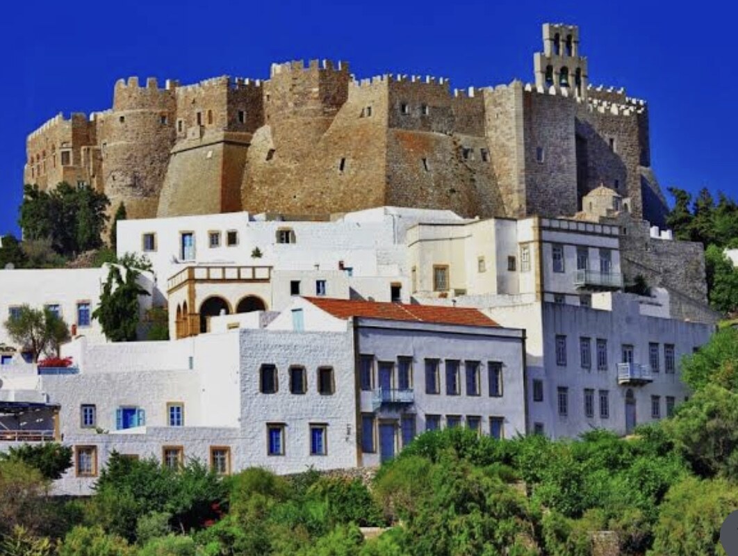 Stock photo of the crenellated Monastery of Saint John rising above the whitewashed houses of Chora on Patmos