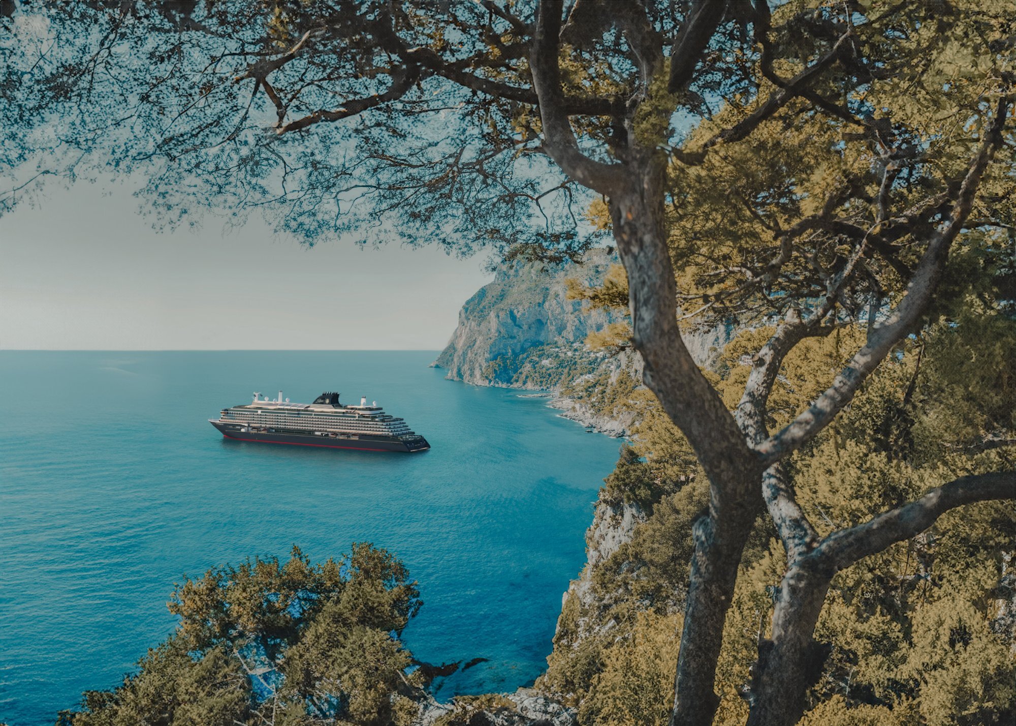 Explora media kit photo of Explora II at anchor in a turquoise bay, framed by pine branches on a cliffside