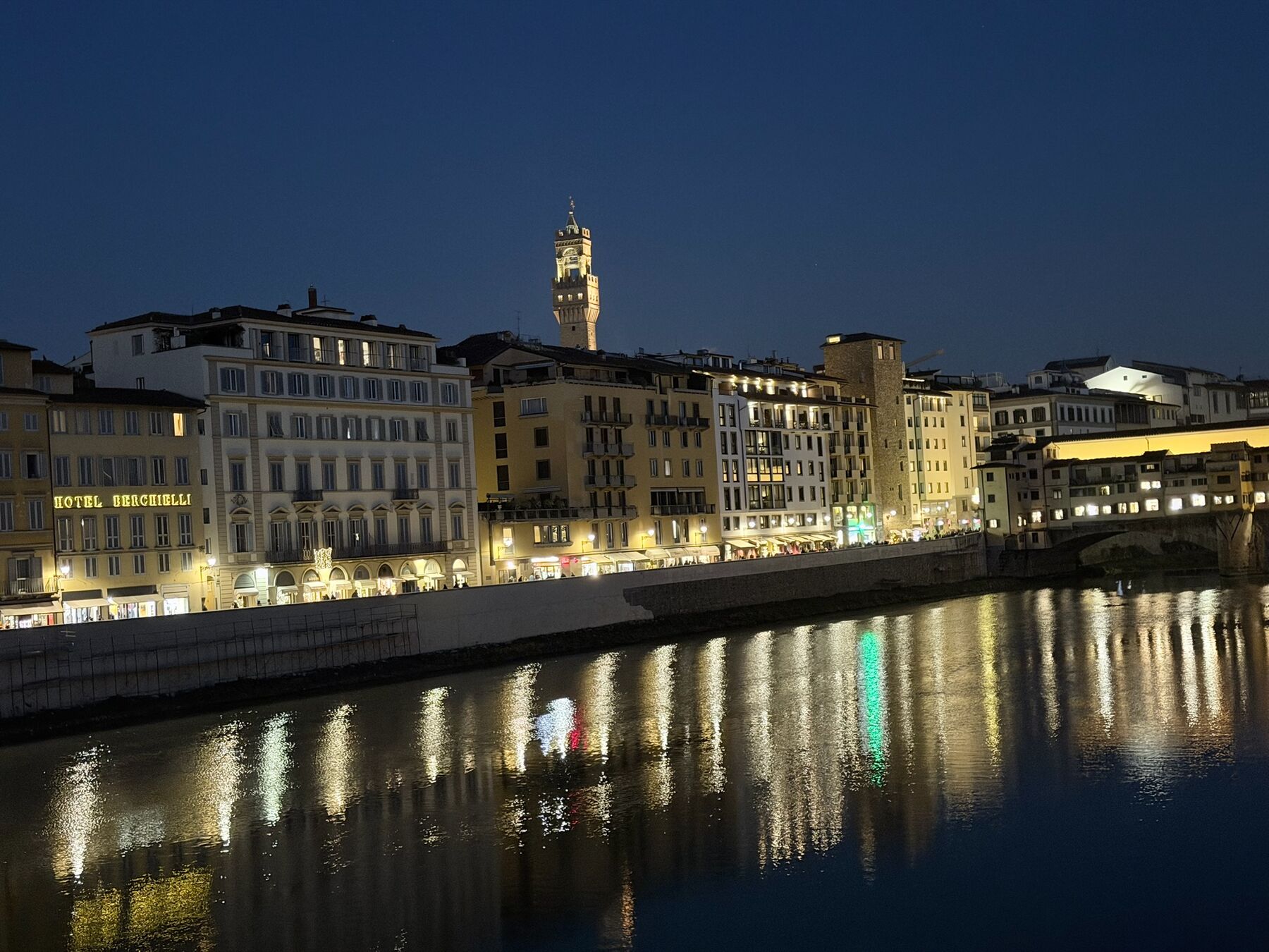 The Arno by night from Oltrarno, Palazzo Vecchio's tower in the distance