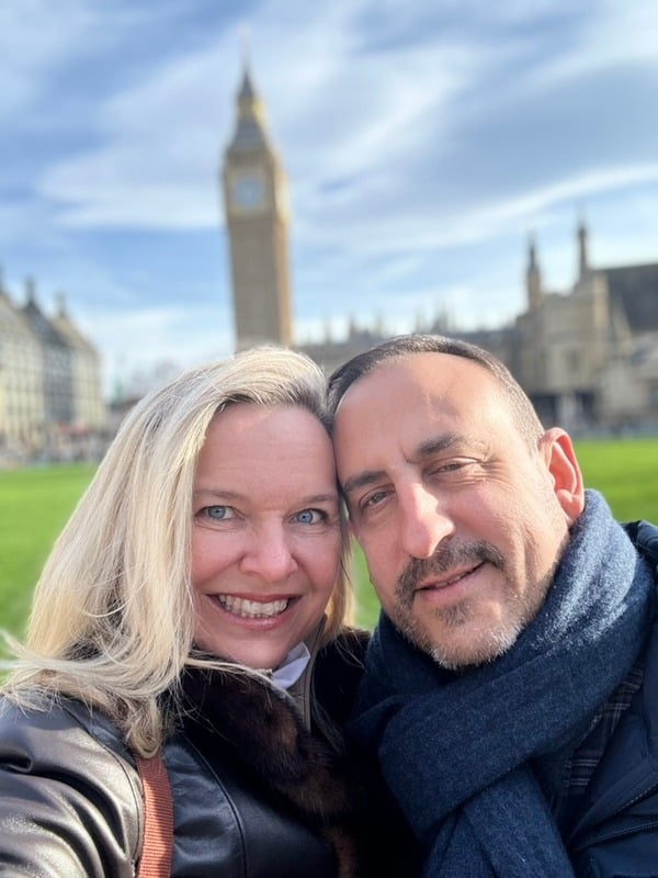 She-Stache and He-Stache cheek to cheek in front of Big Ben