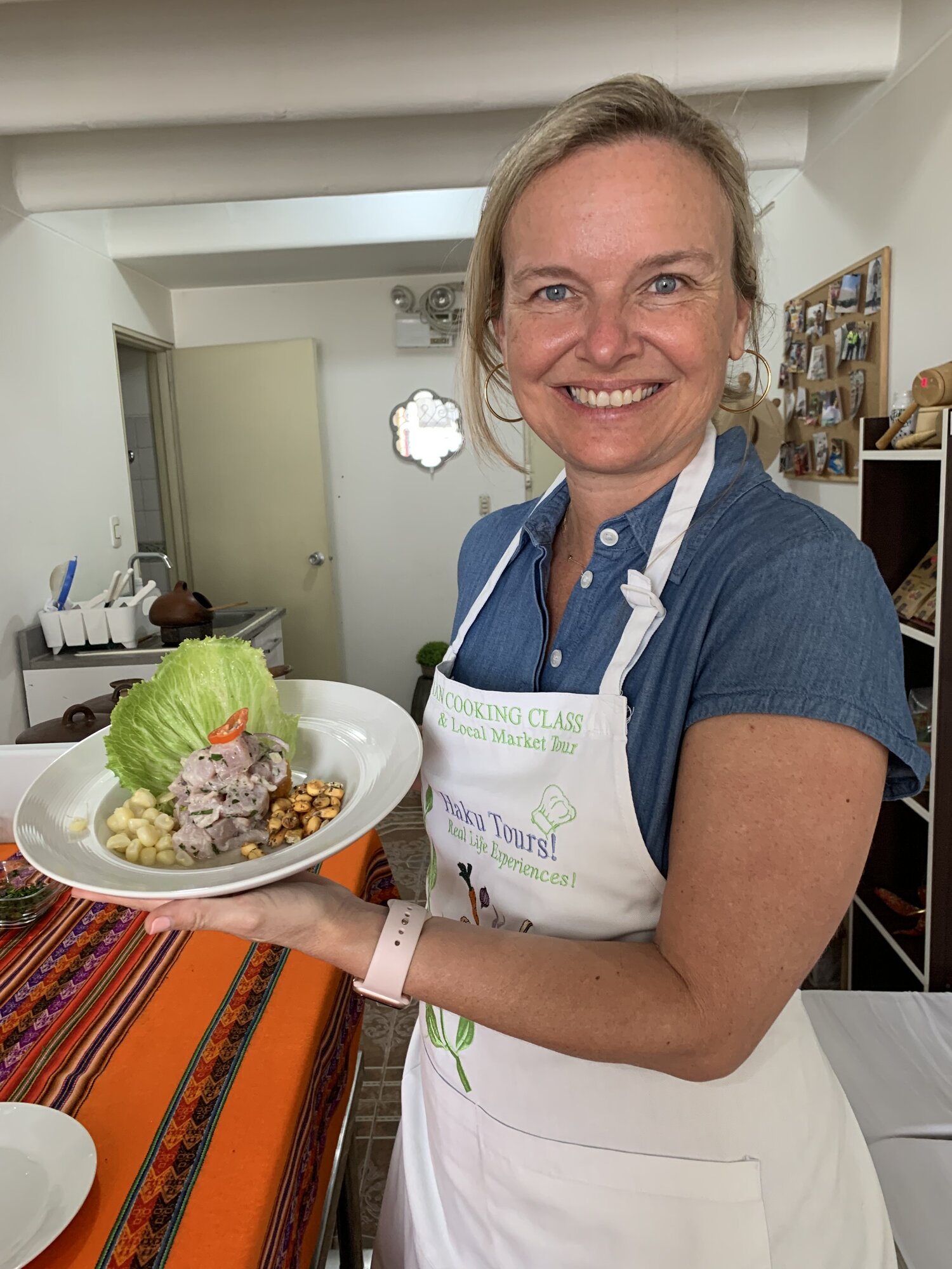 She-Stache holding a plate of ceviche she made at the cooking class