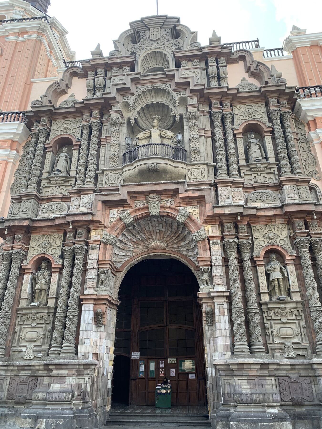 Ornate Baroque church facade with a carved stone entrance in Lima&rsquo;s historic center