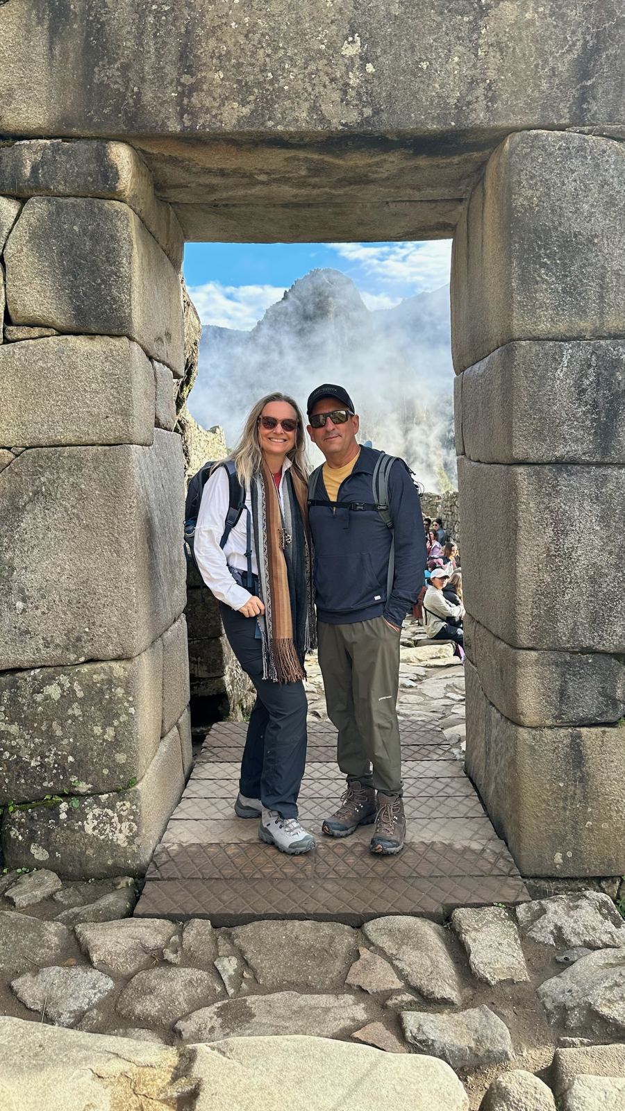 She-Stache and He-Stache standing in a stone trapezoidal doorway with mist behind