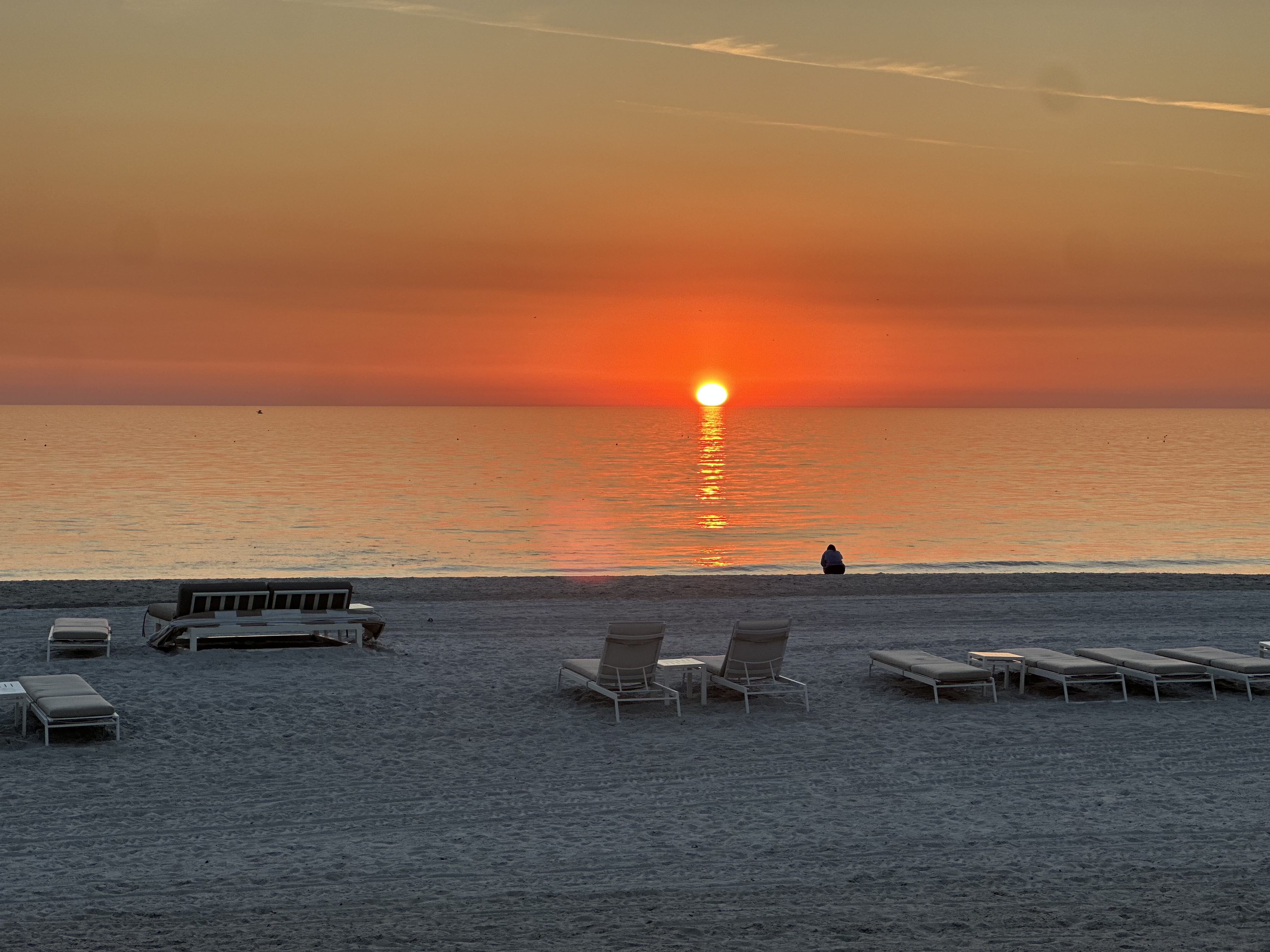Gulf Coast sunset over the water — the nightly main event