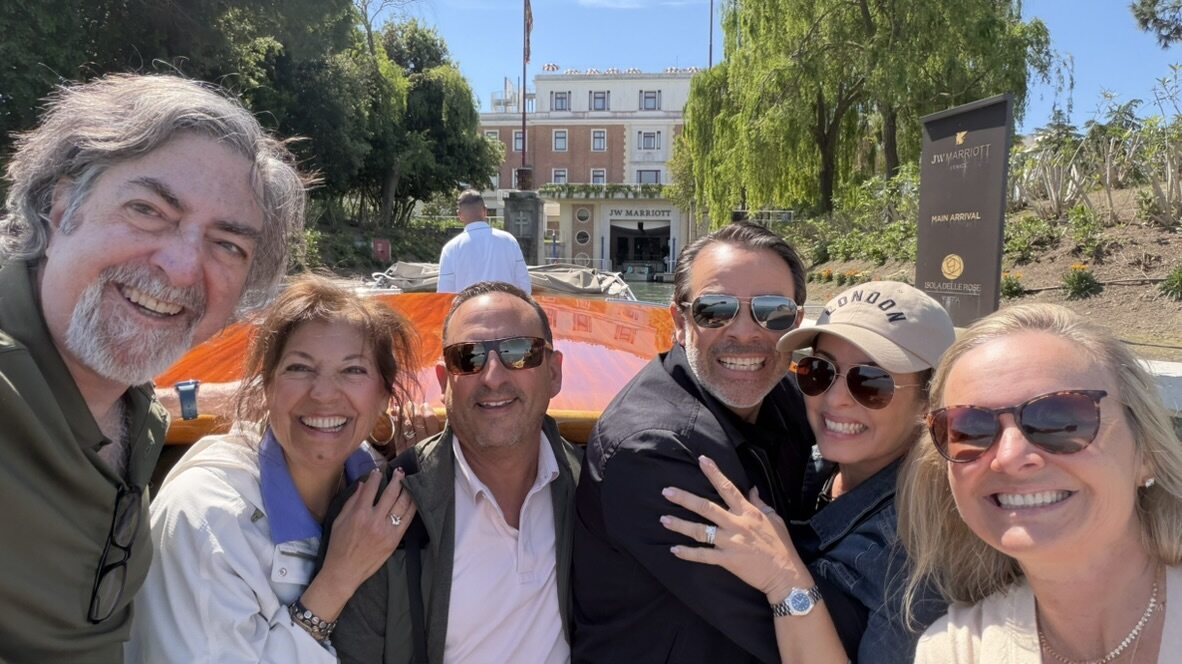 The group of friends squeezed into a selfie at the hotel dock after stepping off the water taxi